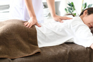 Woman on massage bed enjoying a shiatsu massage
